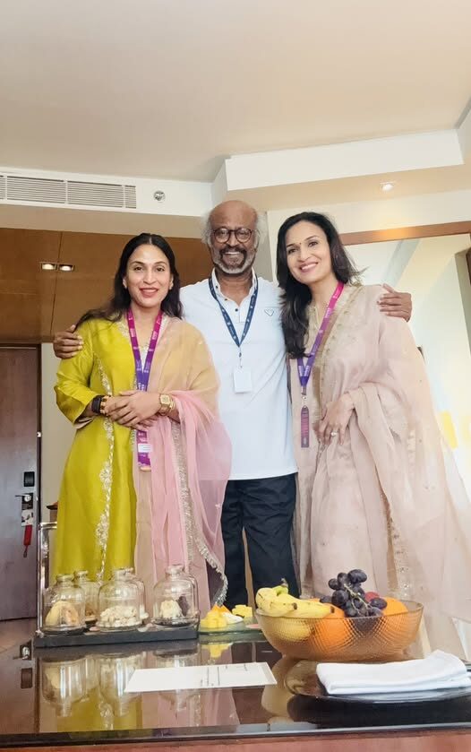 Aishwarya Rajinikanth with her father Rajinikanth and her sister Soundarya Rajinikanth at a film festival