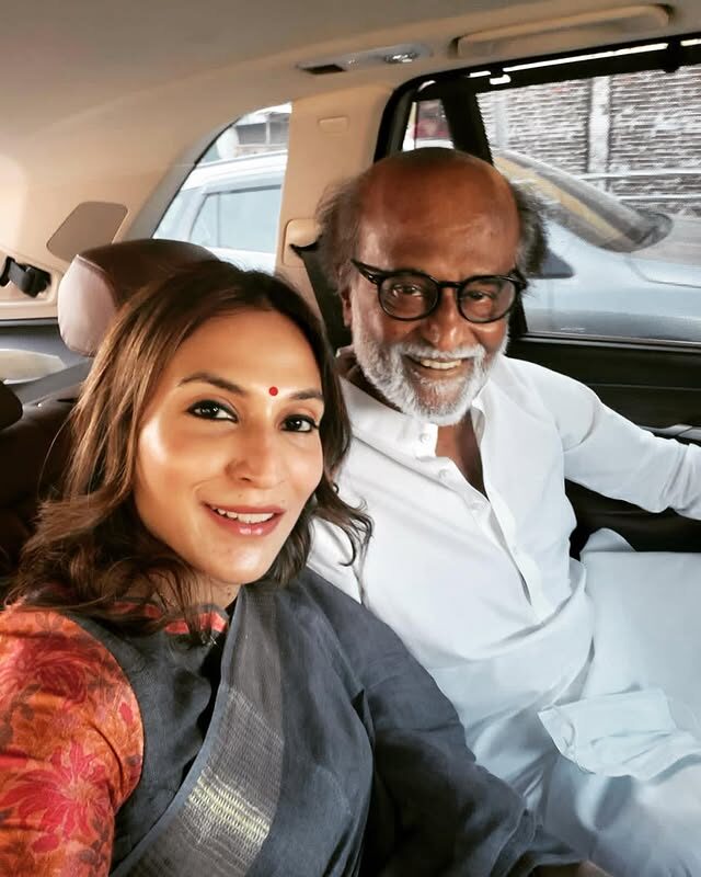 Aishwarya Rajinikanth in a car, photographed with her father Rajinikanth while travelling