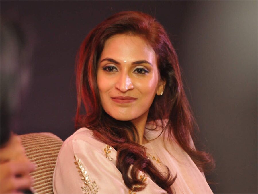 Close portrait of Aishwarya Rajinikanth in a pale pink outfit, looking to camera
